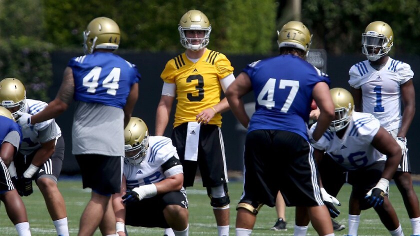 UCLA quarterback Josh Rosen lines up with the offense during the first day of training camp in Westwood on Aug. 8.
