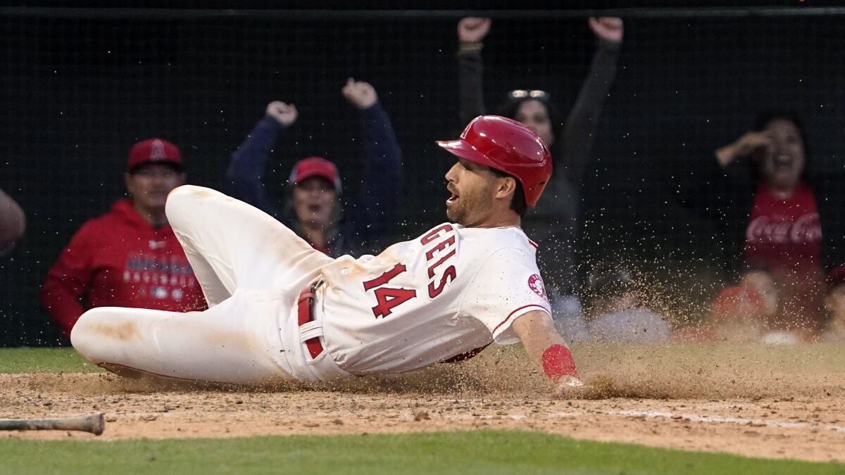 Angels' Tyler Wade scores on a Max Stassi walk-off single during the ninth inning.