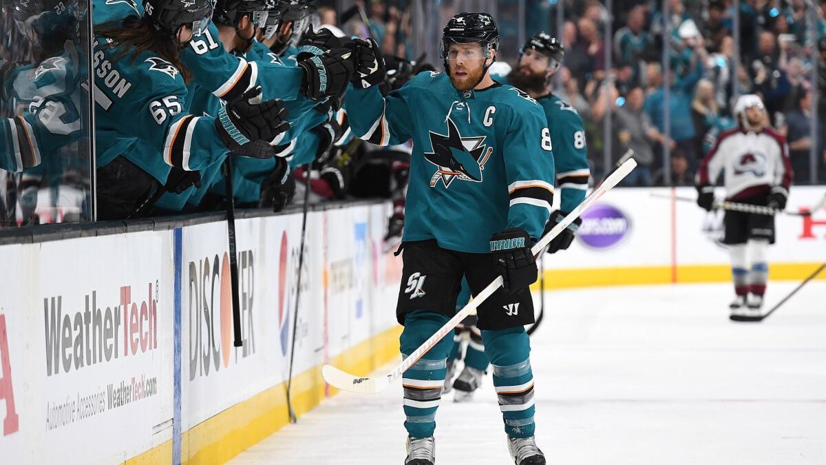 San Jose Sharks' Joe Pavelski is congratulated by teammates after he scored a goal against the Colorado Avalanche during the first period in Game 7 of the Western Conference second round during the NHL playoffs on Wednesday in San Jose.