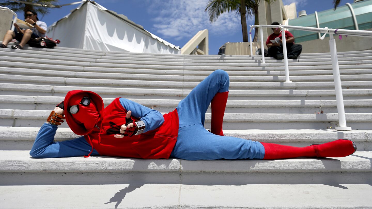 Aaron Serfozo of Mission Viejo poses in his Spider-Man costume on the opening day of Comic-Con International.