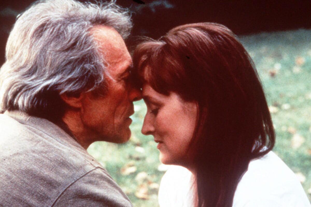 This undated film image released by Warner Bros. shows Clint Eastwood, left, and actress Meryl Streep in a scene from. "The Bridges of Madison County." The book made into a film starring Meryl Streep and Clint Eastwood, is heading to Broadway as a musical. Producers said Thursday, June 6, 2013, the show, with songs by Jason Robert Brown and a book by Marsha Norman which debuts at the Williamstown Theatre Festival in Massachusetts this August, will land at the Gerald Schoenfeld Theater in January. (AP Photo/Warner Bros., file) ** Usable by LA and DC Only **