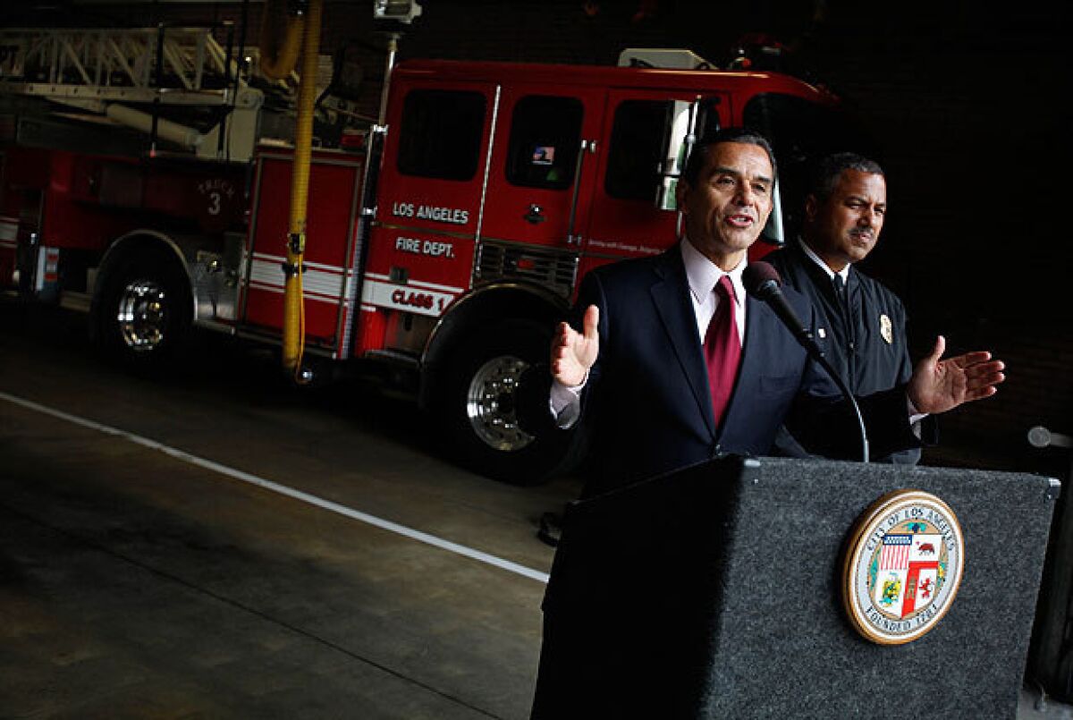 Mayor Antonio Villaraigosa and Los Angeles Fire Department Chief Brian Cummings are shown during a news conference last month. Villaraigosa has ordered Cummings to reveal more data to the public, saying the department "needs more transparency, not less."
