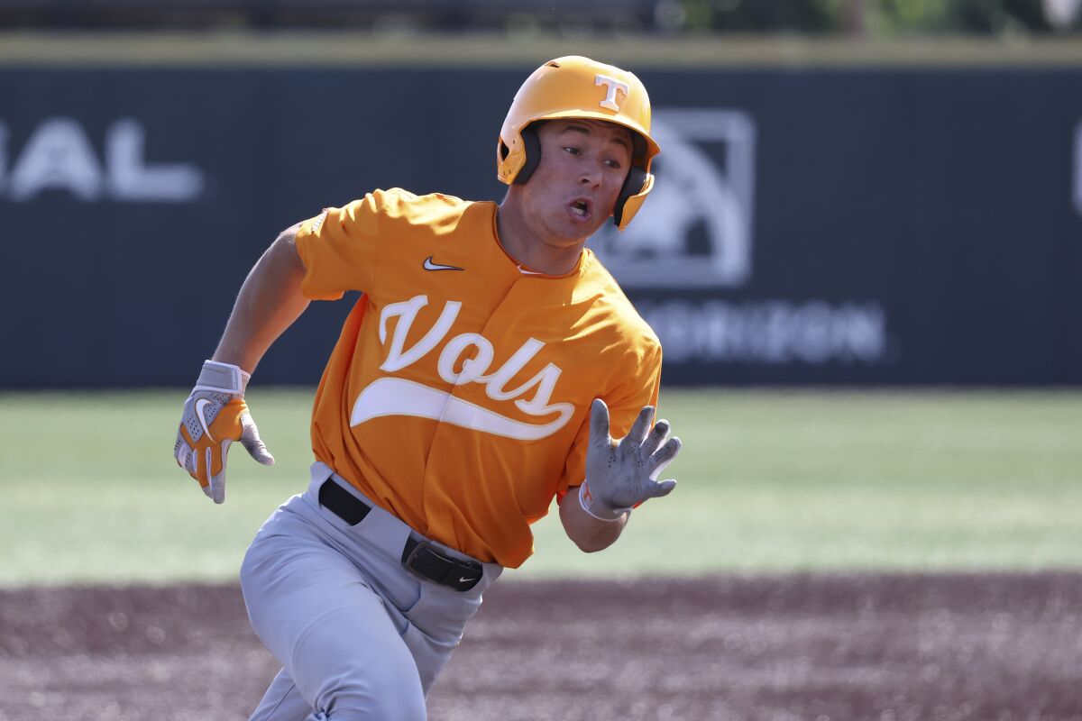 Tennessee's Seth Stephenson rounds third base as he scores on a double by Jorel Ortega in the seventh inning during an NCAA college baseball super regional game against Notre Dame Saturday, June 11, 2022, in Knoxville, Tenn. (AP Photo/Randy Sartin)