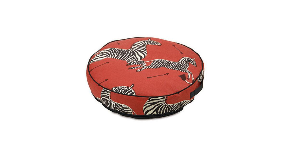 Scalamandre’s signature 1945 print Le Zebre Rouge, which has appeared as wallpaper in Wes Anderson’s "The Royal Tennenbaums," is available in a linen-cotton blend on a 24-inch-diameter bed. It’s $300 and ships in four to five weeks from www.scalamandre.com.