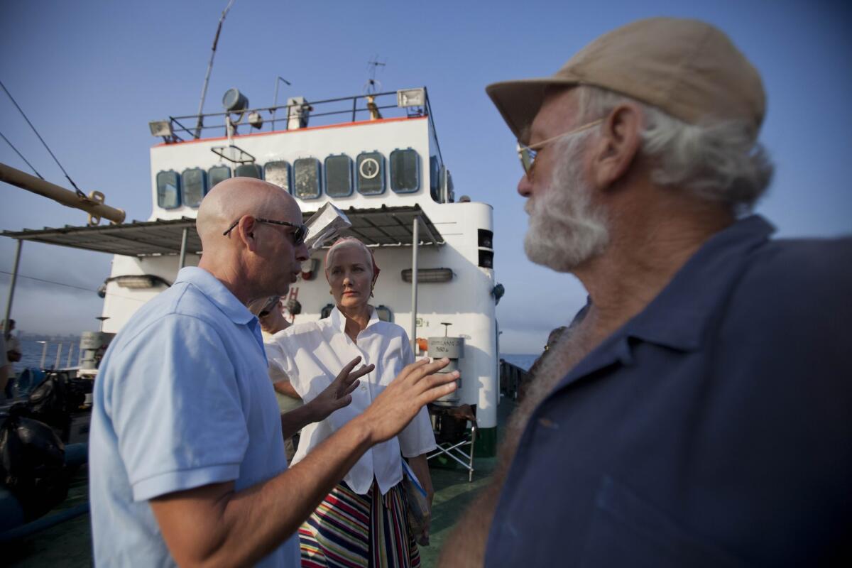 Director Bob Yari, left, works with actors Joely Richardson and Adrian Sparks during the filming of "Papa" in Havana Bay in Cuba.