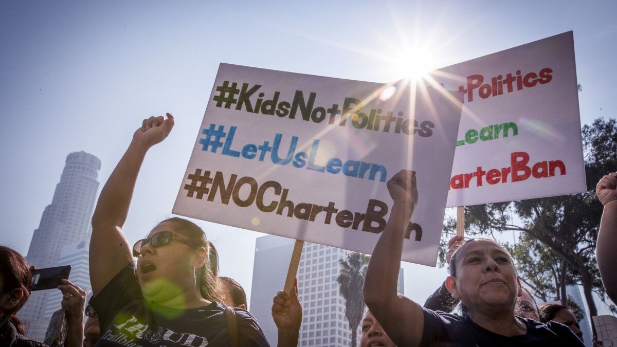 More than 1,000 charter-school supporters held a protest Tuesday outside LAUSD headquarters as the L.A. Board of Education voted on a resolution calling on state officials to support a local moratorium on charter schools. The board also approved the teachers' contract.