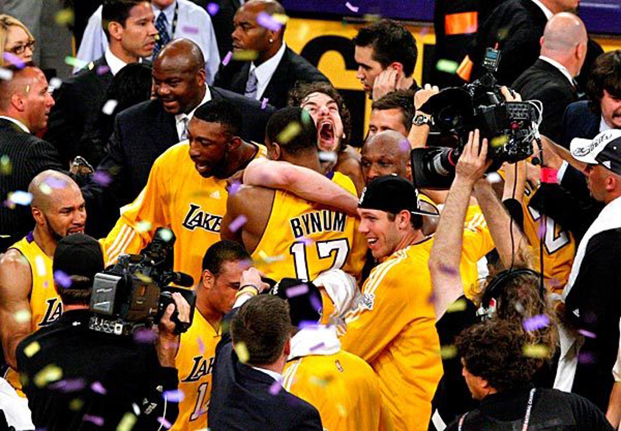 Big men Pau Gasol and Andrew Bynum embrace during the Lakers' 2010 NBA title celebration after beating Boston in Game 7.