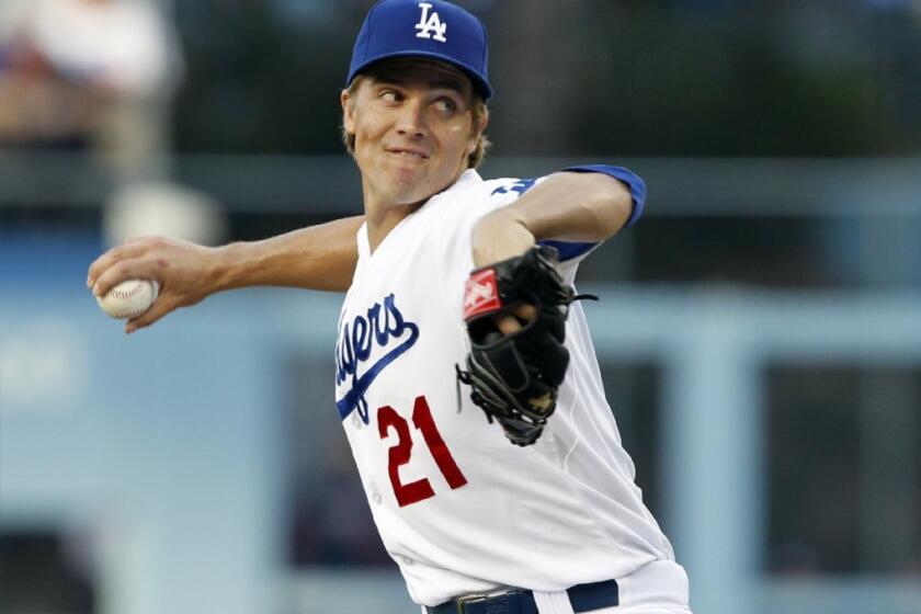 Dodgers starting pitcher Zack Greinke throws against the Atlanta Braves on Thursday.