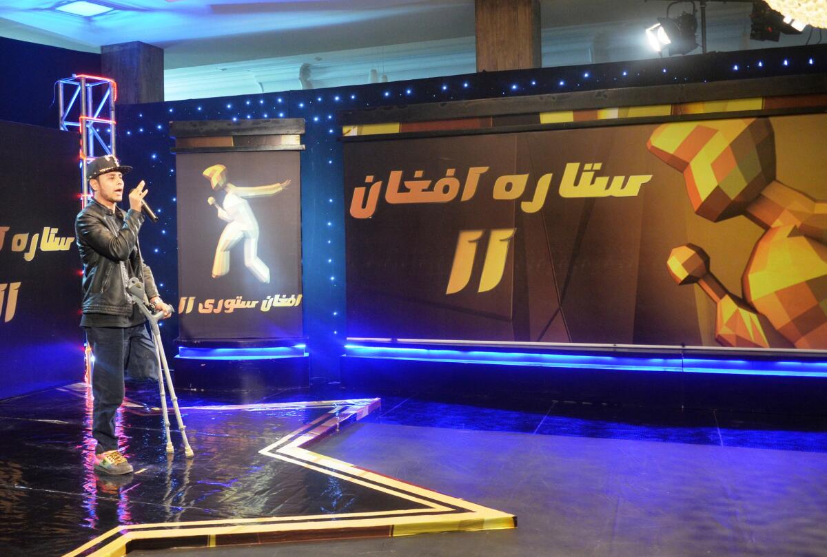 Contestant Farid Taqid, 19, tries out for "Afghan Star," a singing competition TV show in Afghanistan.
