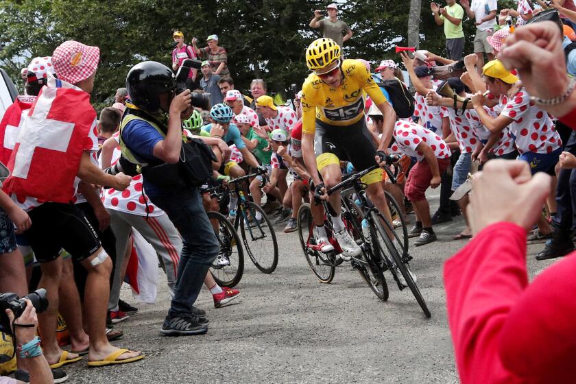 Britain's Chris Froome, wearing the overall leader's yellow jersey, climbs during the ninth stage of the Tour de France cycling race over 181.5 kilometers (112.8 miles) with start in Nantua and finish in Chambery, France, Sunday, July 9, 2017. (AP Photo/Christophe Ena)