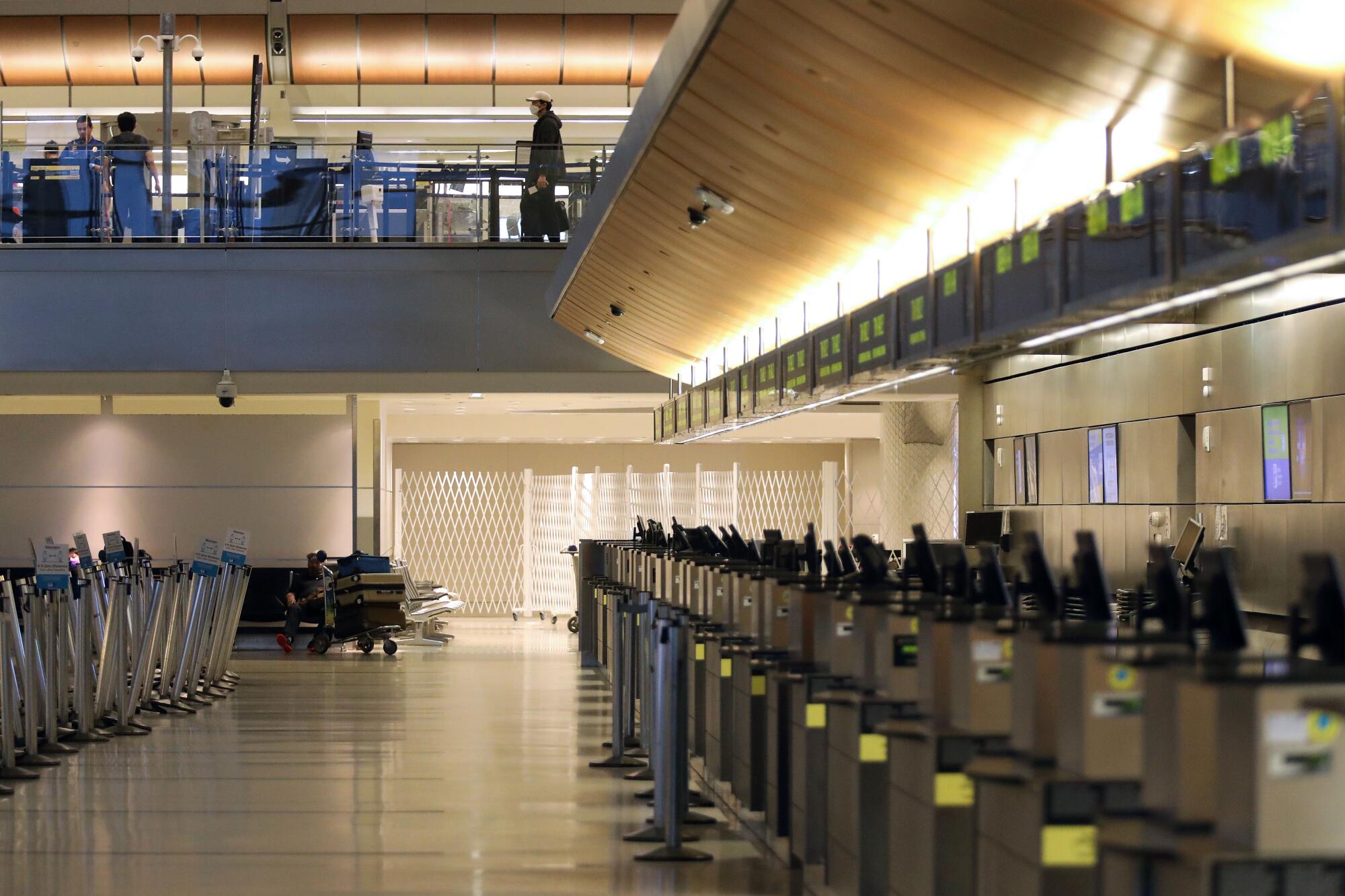 Tom Bradley International Terminal is empty as the coronavirus outbreak has brought passenger traffic at LAX to a near halt.
