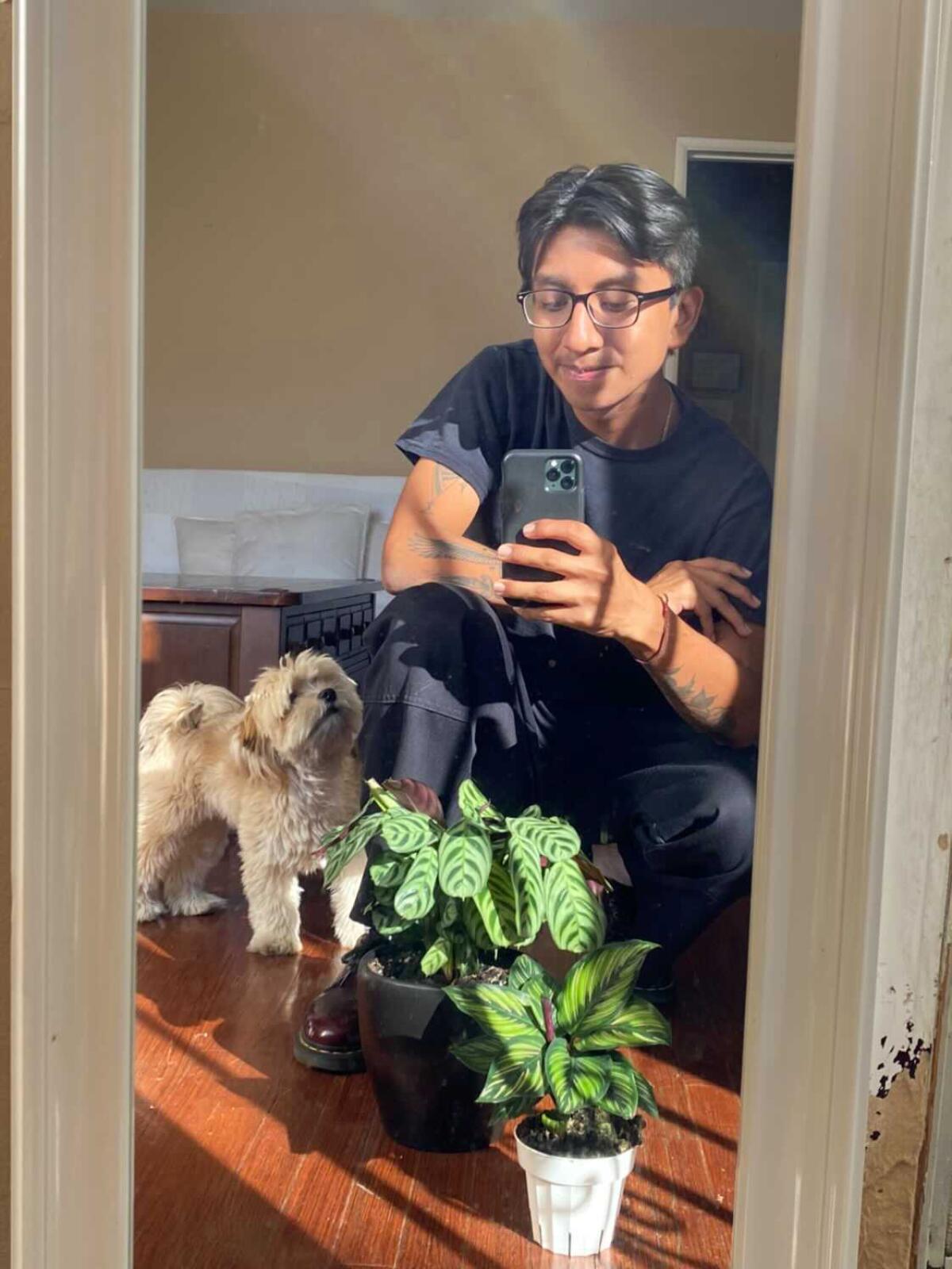 Reader Danny Lopez with his plants and dog