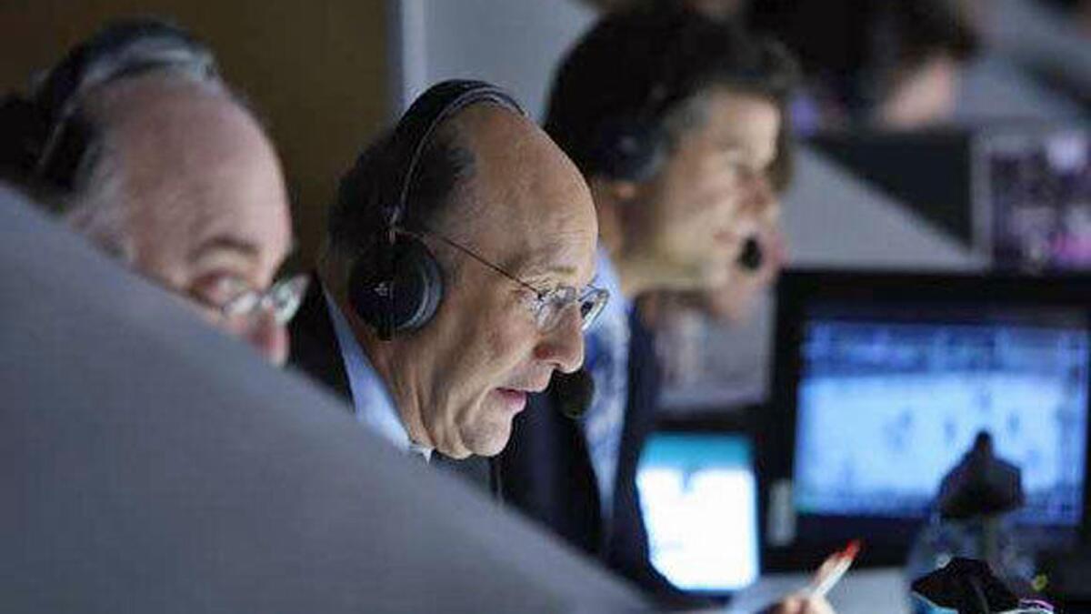 Bob Miller, center, is the legendary voice of the Los Angeles Kings.