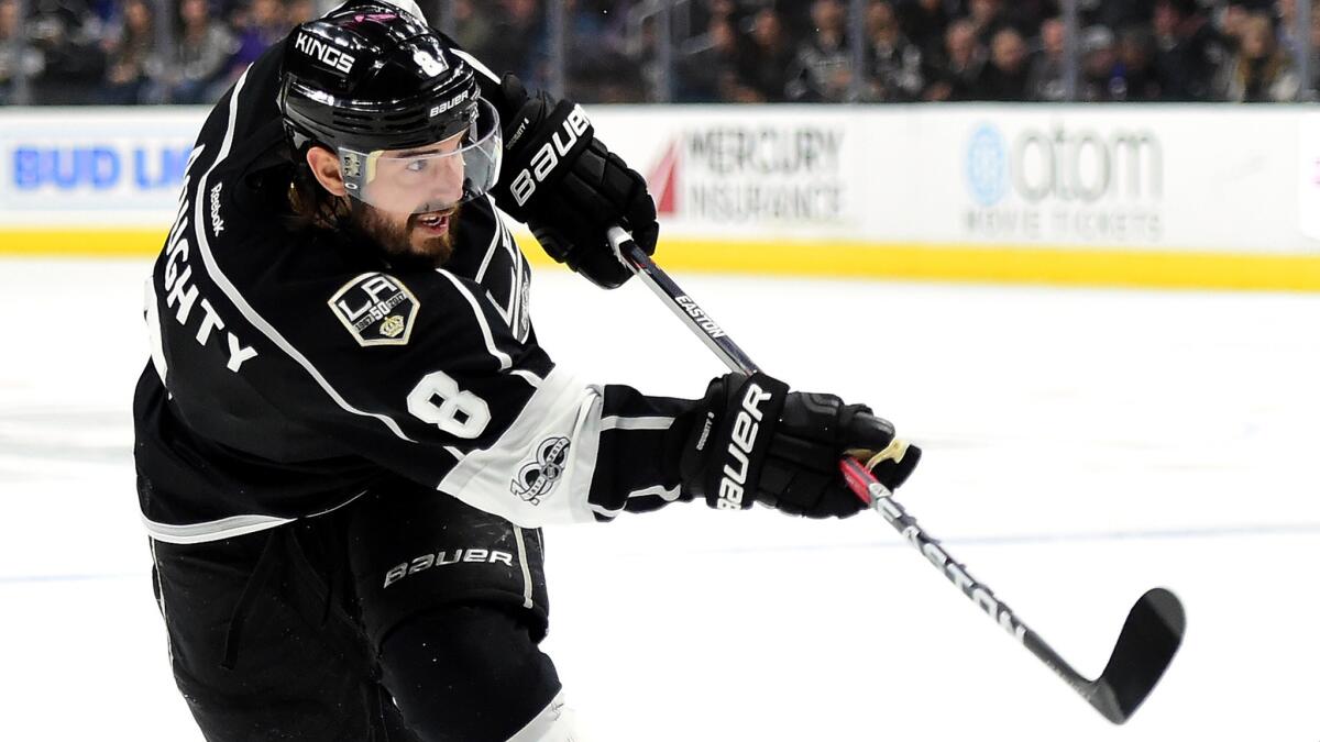 Drew Doughty's ice time, an average of 27 minutes 13 seconds a game, ranks second in the NHL before play this weekend. (Harry How / Getty Images)