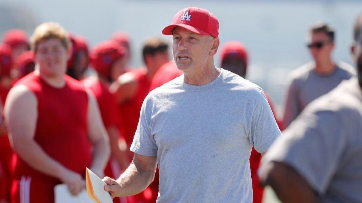 Los Alamitos High football coach Ray Fenton, seen on Aug. 22, hopes to lead the Griffins to a marquee victory over Long Beach Poly on Friday at Cerritos College.