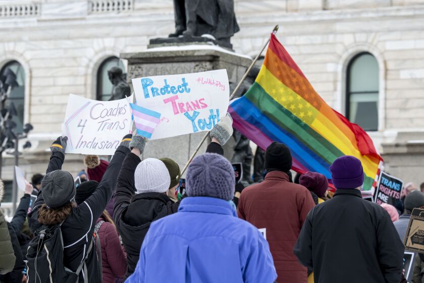 Minneasotans hold a rally at the capitol to support trans kids in Minnesota, Texas, in 2022.