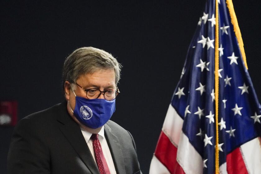 U.S. Attorney General William Barr arrives to speak with federal officials for a panel discussion on combatting human trafficking at the U.S. Attorney's Office on Monday, Sept. 21, 2020, in Atlanta. (AP Photo/Brynn Anderson)