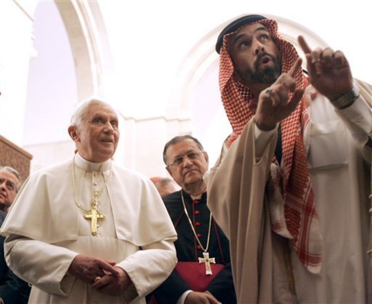 Pope Benedict XVI, left, flanked by Prince Ghazi Bin Talal visits King Hussein Bin Talal mosque in Amman, Jordan, Saturday, May 9, 2009.(AP Photo/Pier Paolo Cito)