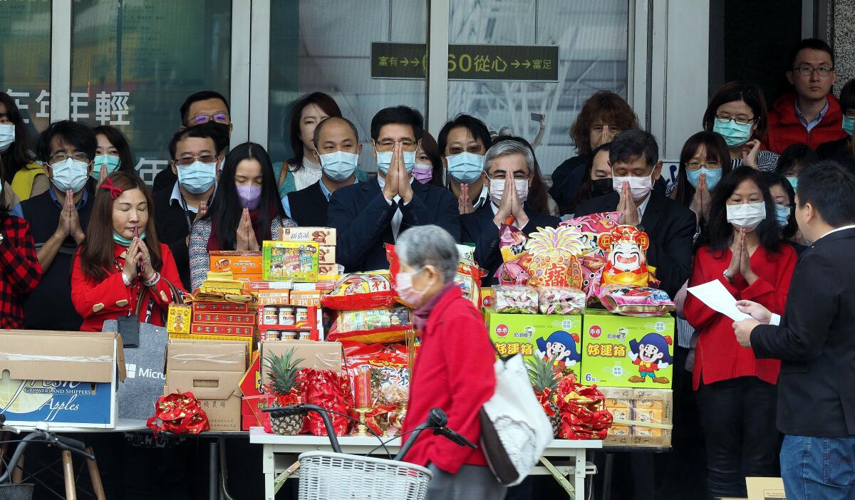 Mandatory Credit: Photo by DAVID CHANG/EPA-EFE/REX (10549713d) Workers pray for business prosperity in Taiwan 