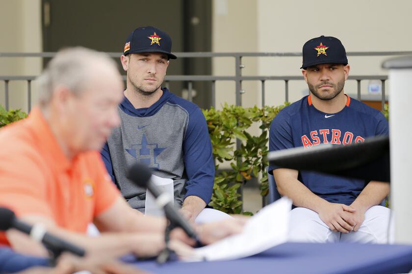 WEST PALM BEACH, FLORIDA - FEBRUARY 13: Alex Bregman #2 and Jose Altuve #27 of the Houston Astros look on as owner Jim Crane reads a prepared statement during a press conference at FITTEAM Ballpark of The Palm Beaches on February 13, 2020 in West Palm Beach, Florida. (Photo by Michael Reaves/Getty Images)