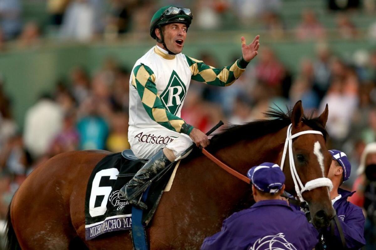 Gary Stevens celebrates aboard Mucho Macho Man after winning the Breeders' Cup Classic at Santa Anita Park on Nov. 2. Both are nominated for Eclipse Awards.