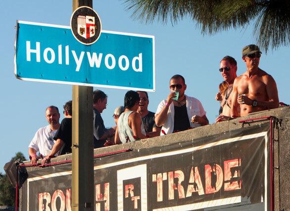 Revelers gather on a rooftop on Sunset Blvd. to get a view of the Sunset Junction Festival, August 24, 2008 in Los Angeles.