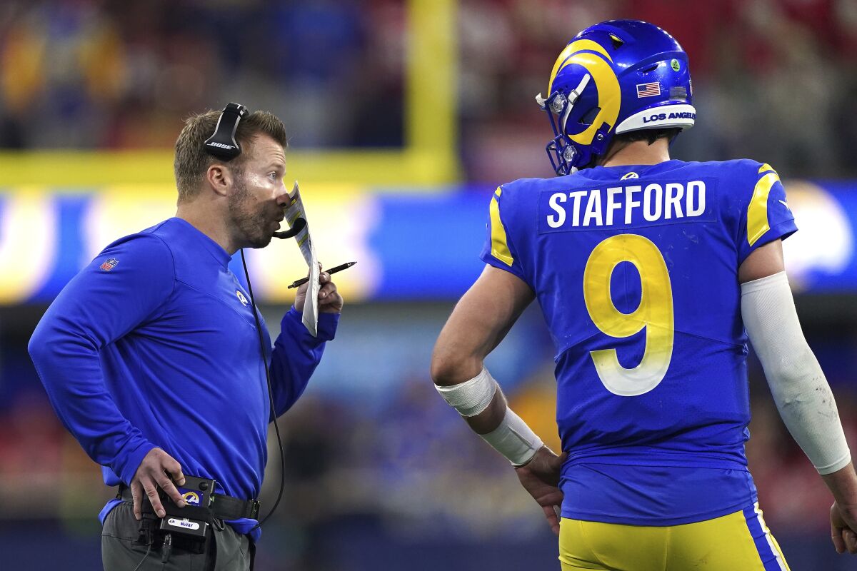 Rams coach Sean McVay talks with quarterback Matthew Stafford.