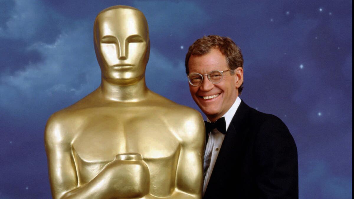In 1995, David Letterman was tapped to host the Oscars, but his irreverent humor failed to mesh with the grand tone of the event. Most awkward was a bizarre gag in which he jokingly introduced Oprah Winfrey to Uma Thurman from the stage (say it with us: "Oprah...Uma... Uma...Oprah").