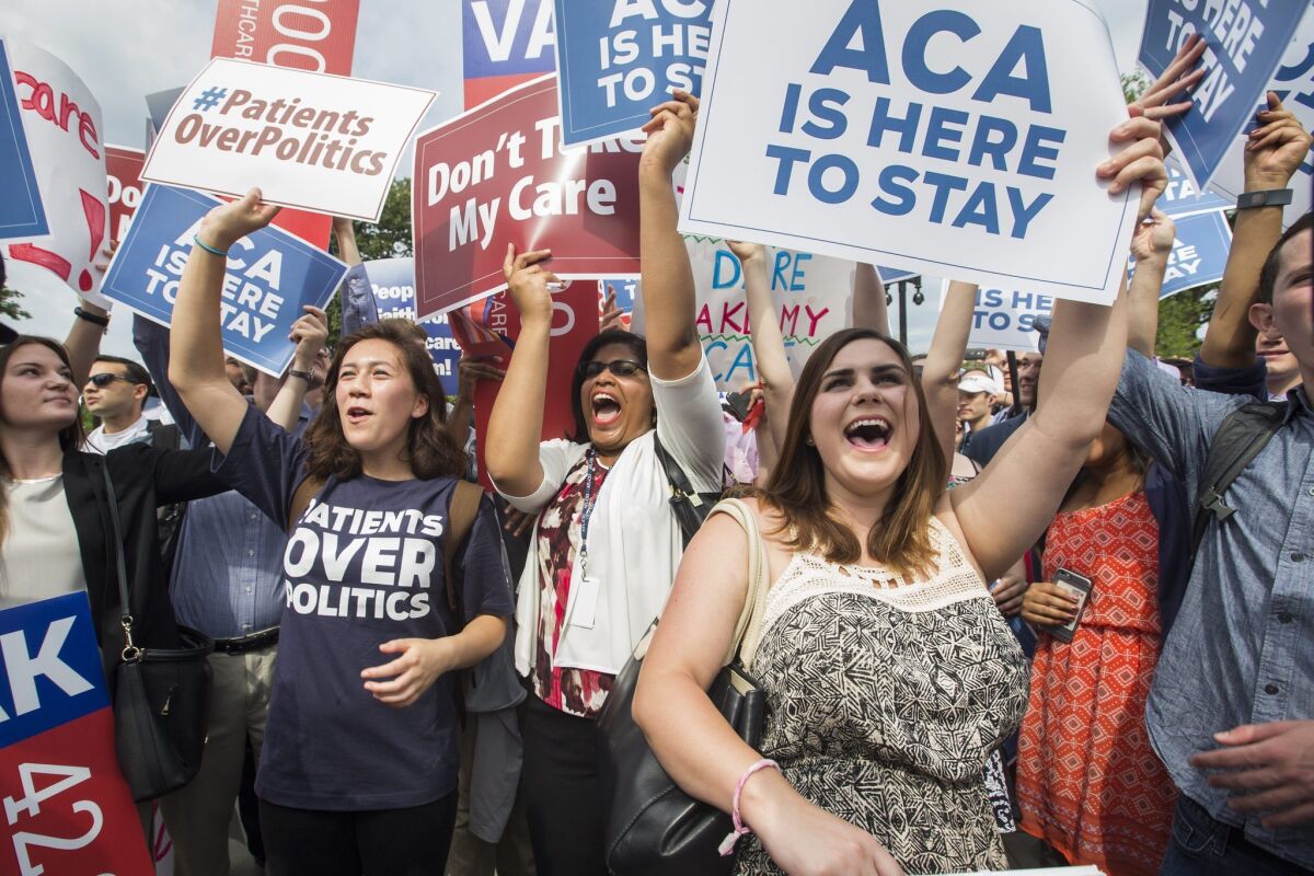 Supporters of the Affordable Care Act cheer after the Supreme Court ruled that Obamacare tax credits can go to residents of any state, on June 25, 2015.