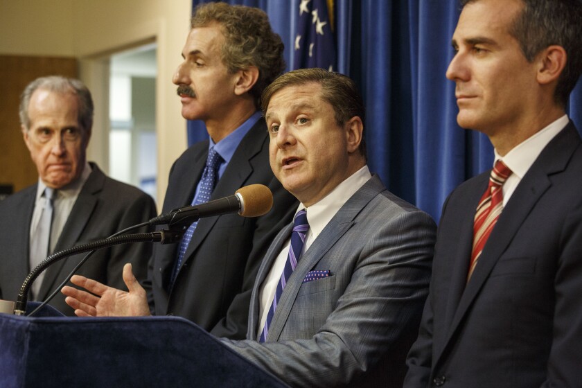 Los Angeles Controller Ron Galperin, shown with other city officials in 2015, warned Wednesday that revenue for the L.A. city budget next fiscal year could come in far lower than previously projected, due in large part to the crisis spurred by the coronavirus pandemic.