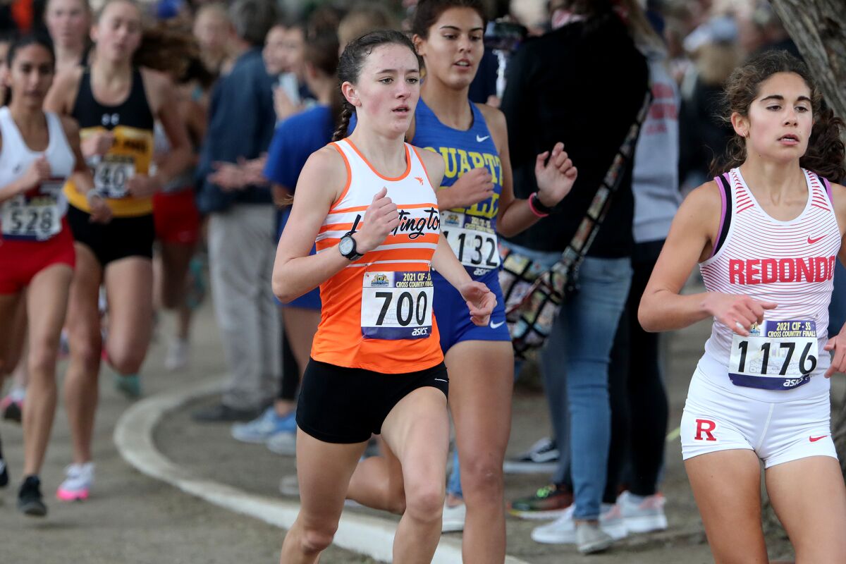 Huntington Beach sophomore Makenzie McRae (700) competes in the girls' Division 1 race during the CIF finals on Nov. 20.