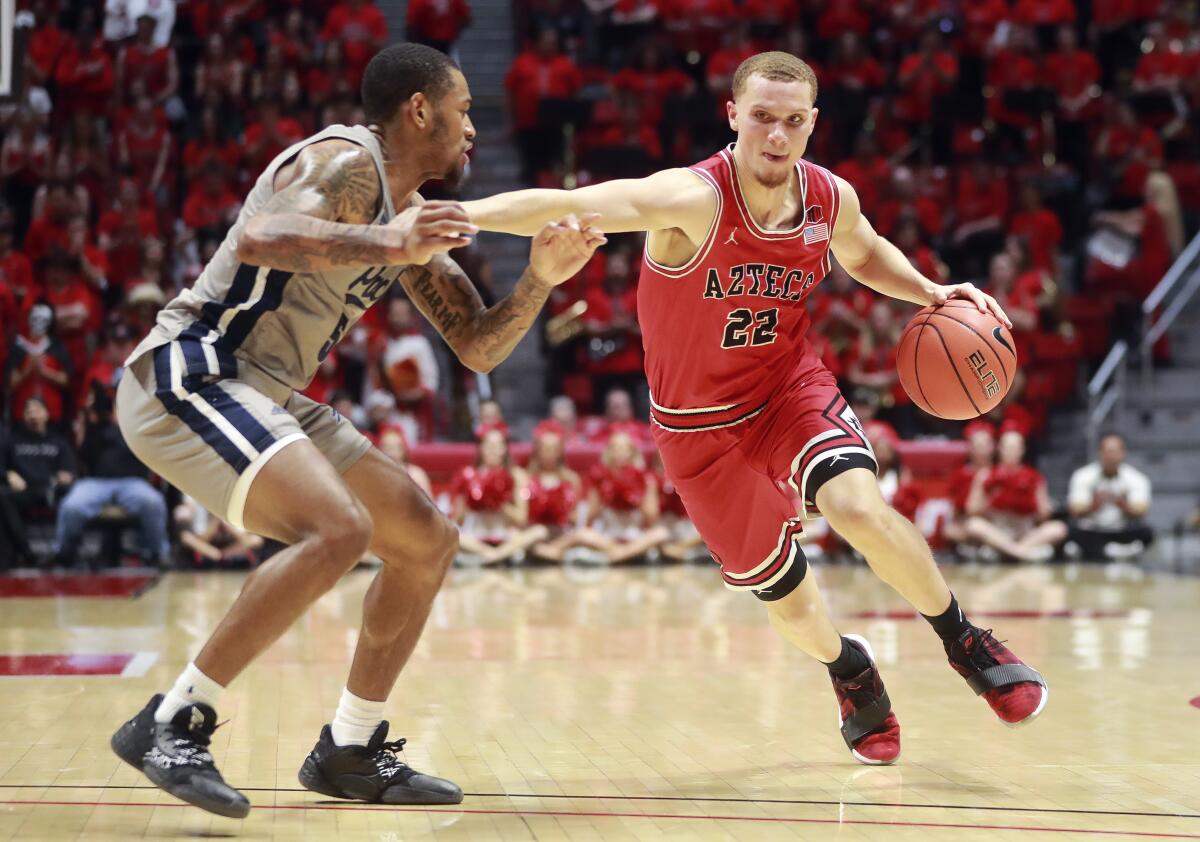 Malachi Flynn of SDSU would not have had to sit out a season under a proposed rule that would grant immediate eligibility to first-time transfers in basketball and football.