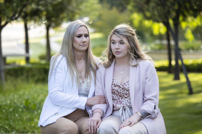 Fontana, CA - June 08: Amanda Carley, left, and daughter Madisyn Carley, 20, right, sit for portraits near their home on Wednesday, June 8, 2022 in Fontana, CA. (Brian van der Brug / Los Angeles Times)