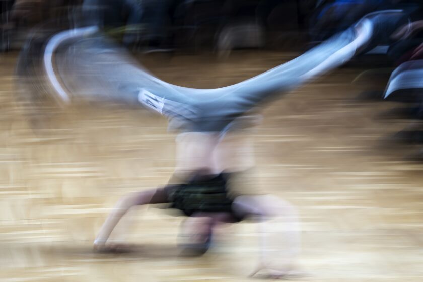 FILE - In this file picture taken with a long time exposure on March 12, 2017, Jannis Bednarzik performs during the German Breakdance Championships in Magdeburg, Germany. Getting hip to breakdancing's appeal with young audiences, organizers of the 2024 Paris Olympics want the dance sport that spread from New York in the 1970s to become a medal event at the games. (AP Photo/Jens Meyer, File)