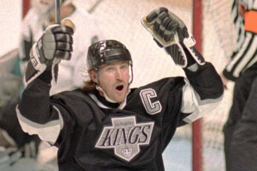 Wayne Gretzky celebrates after scoring a goal for the Kings in 1994.