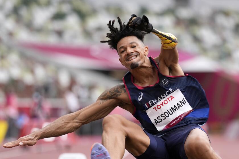 FILE - France's Arnaud Assoumani competes in the men's T47 long jump final during the 2020 Paralympics at the National Stadium in Tokyo, Tuesday, Aug. 31, 2021. The 100 Days to Go campaign for the Aug 28-Sept. 8 Paralympic Games begins on Monday, May 20, 2024, and features three Paralympic athletes alone in an empty stadium with the slogan: “Il ne me manque rien, sauf vous” (I’m not missing anything, except you). (AP Photo/Eugene Hoshiko, File)