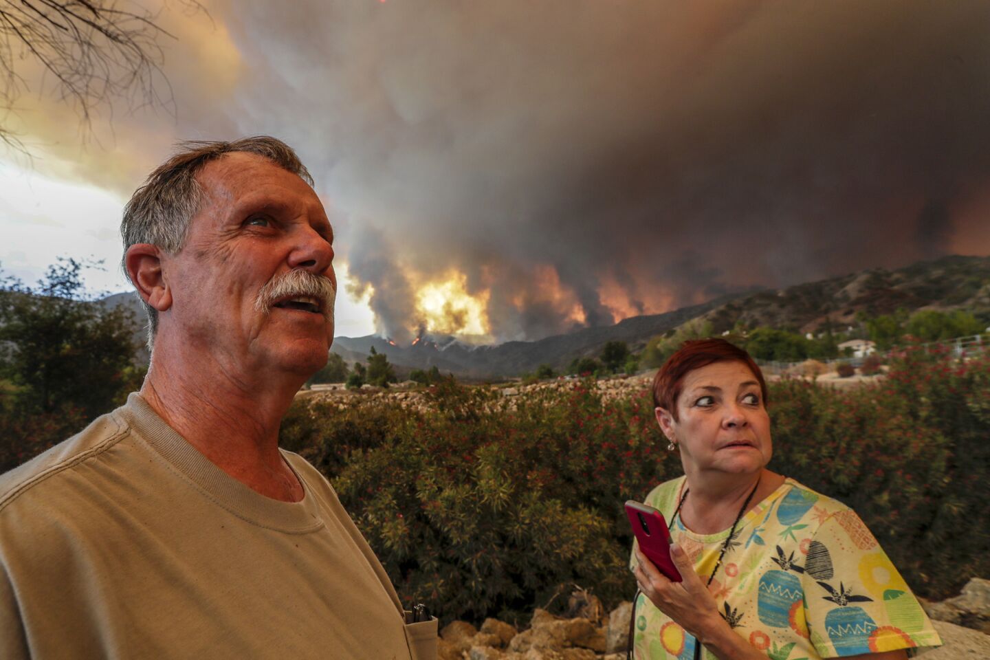 Lester and Blanca Fronk watch for planes fighting the Holy Fire in Lake Elsinore.