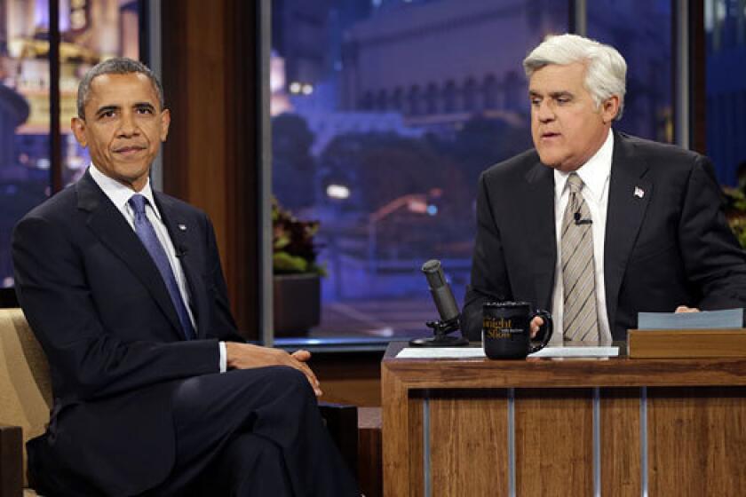 President Obama visits with Jay Leno on "The Tonight Show" last year. When he makes an appearance Tuesday, he'll probably want to talk about middle-class jobs and the economy.