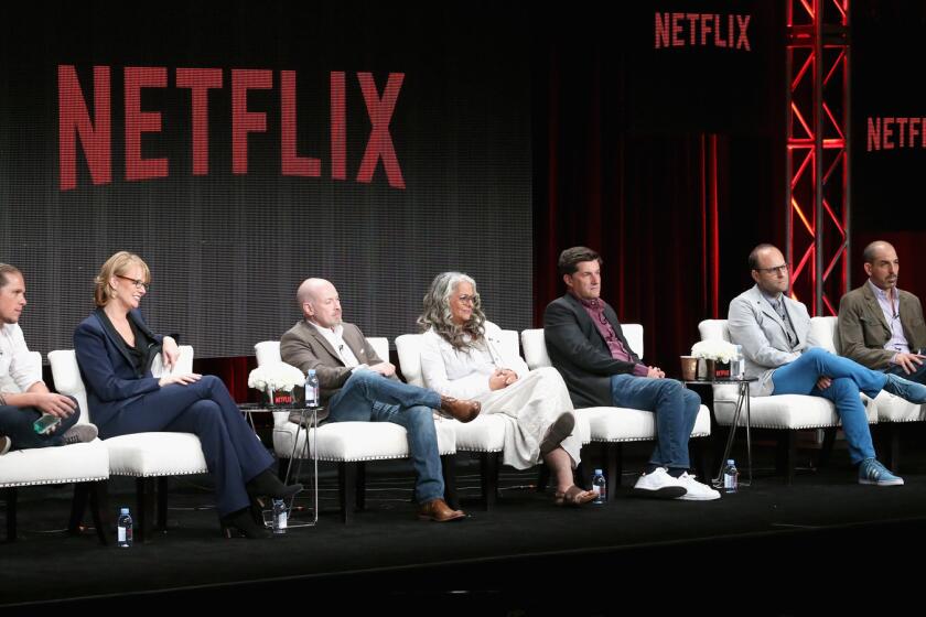 Gaz Alazraki, Melissa Rosenberg, Steven DeKnight, Marta Kauffman, Michael Showalter, Raphael Bob-Waksberg and Glenn Kessler speak onstage during a Netflix showrunners panel discussion July 28 at the Beverly Hilton.