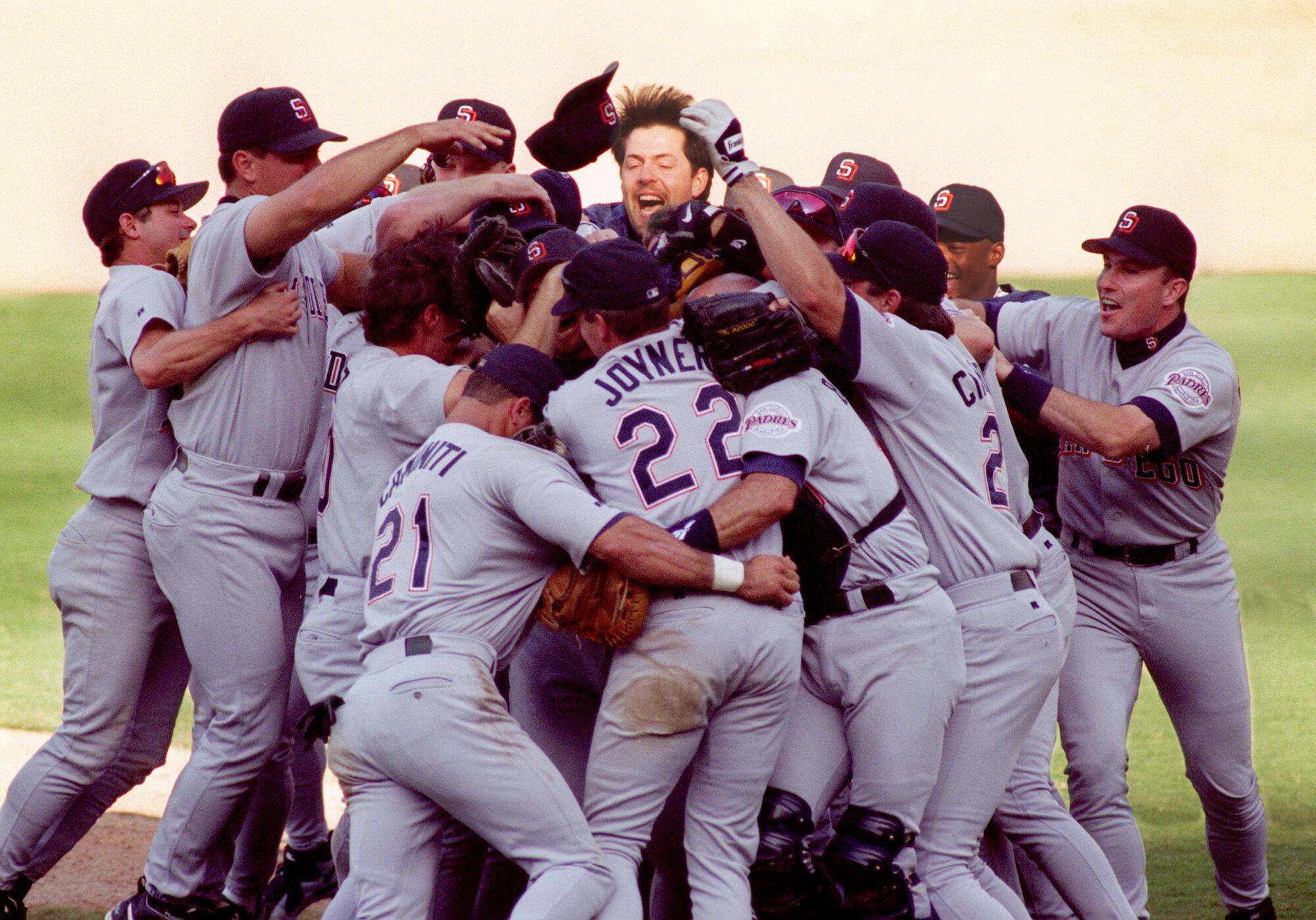 San Diego pitcher Bob Tewksbury, top center, celebrates after the Padres defeated the Dodgers.