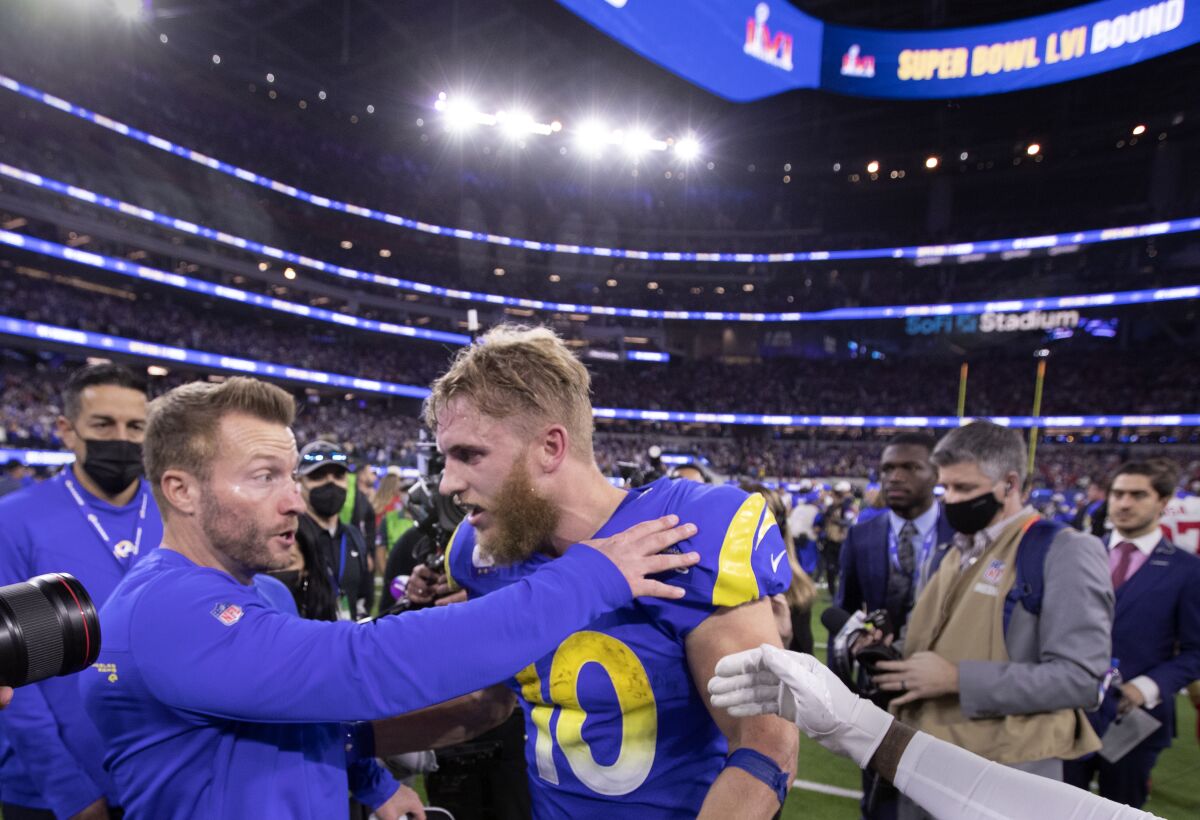 Rams receiver Cooper Kupp (10) and coach Sean McVay share a moment after their NFC championship victory.