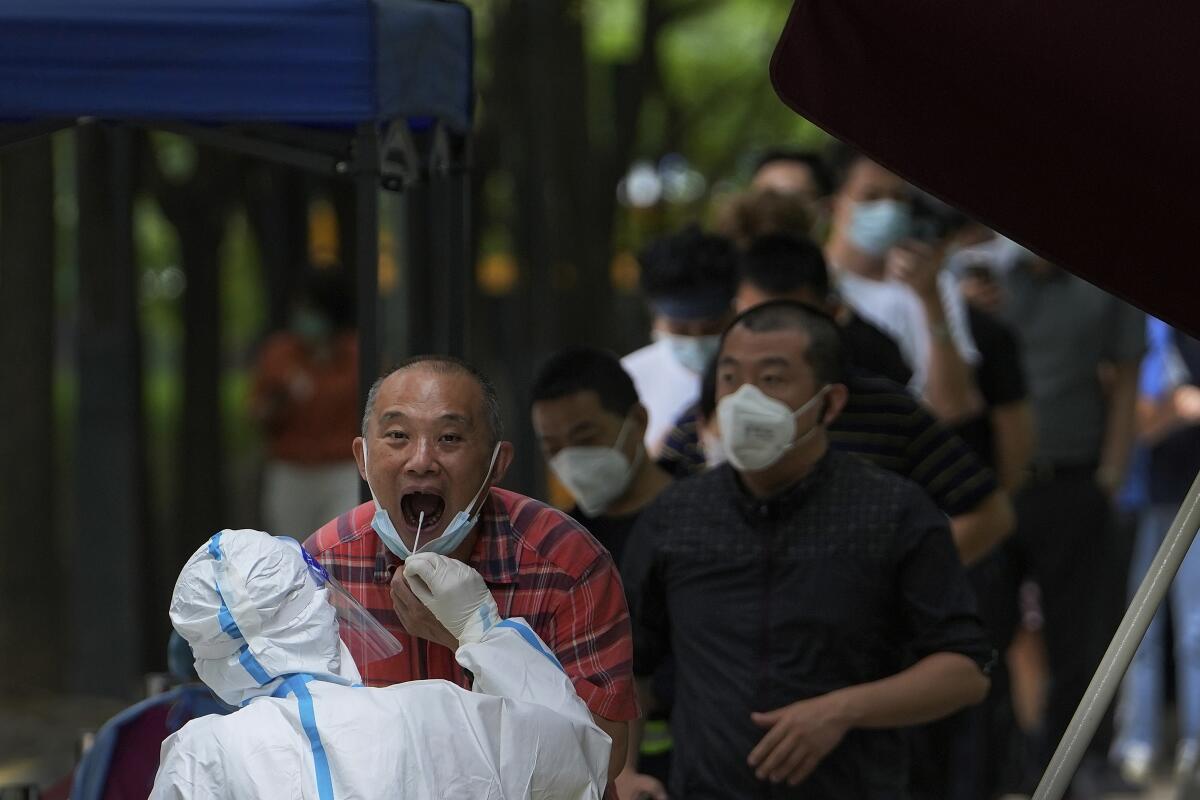 Man getting throat swabbed for coronavirus test