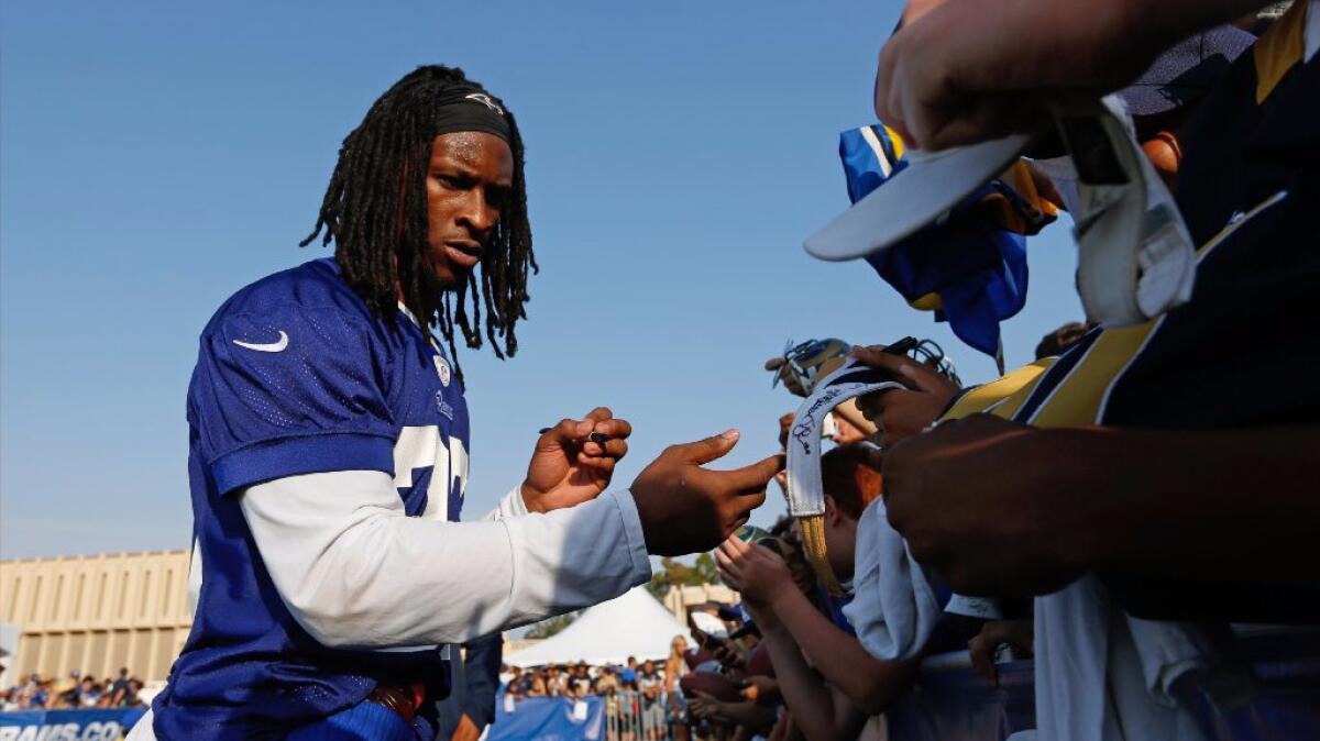 Rams running back Todd Gurley signs autographs for fans at training camp in Irvine on July 30.