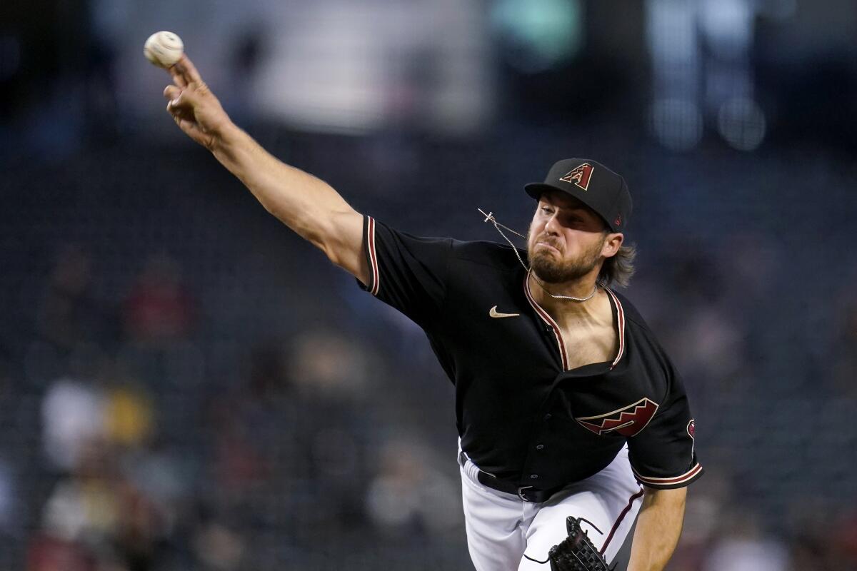 Arizona Diamondbacks starting pitcher Riley Smith throws during the first inning of the team's baseball game against the Cincinnati Reds on Saturday, April 10, 2021, in Phoenix. (AP Photo/Ross D. Franklin)