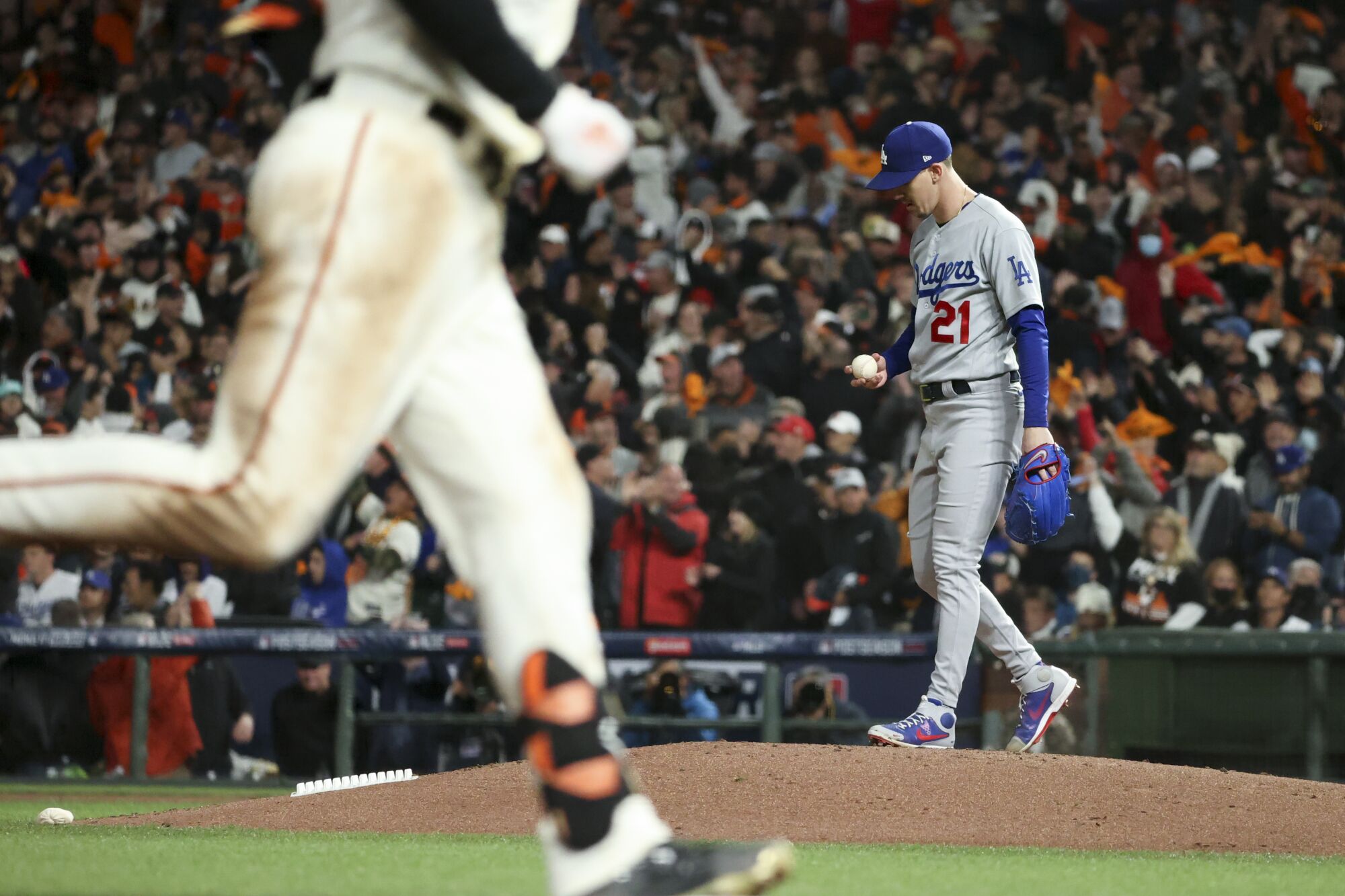 Dodgers' Walker Buehler reacts after giving up a solo home run to Giants' Kris Bryant 