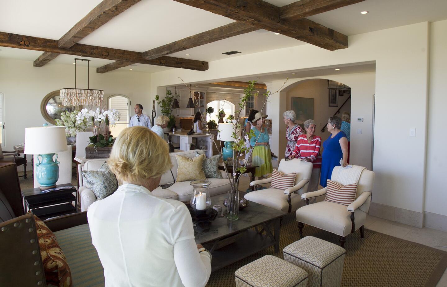 Guests tour the main room at the Buntmann Residence at 2054 East Oceanfront during the Newport Harbor Home tour on Thursday, May 15. (Scott Smeltzer - Daily Pilot)