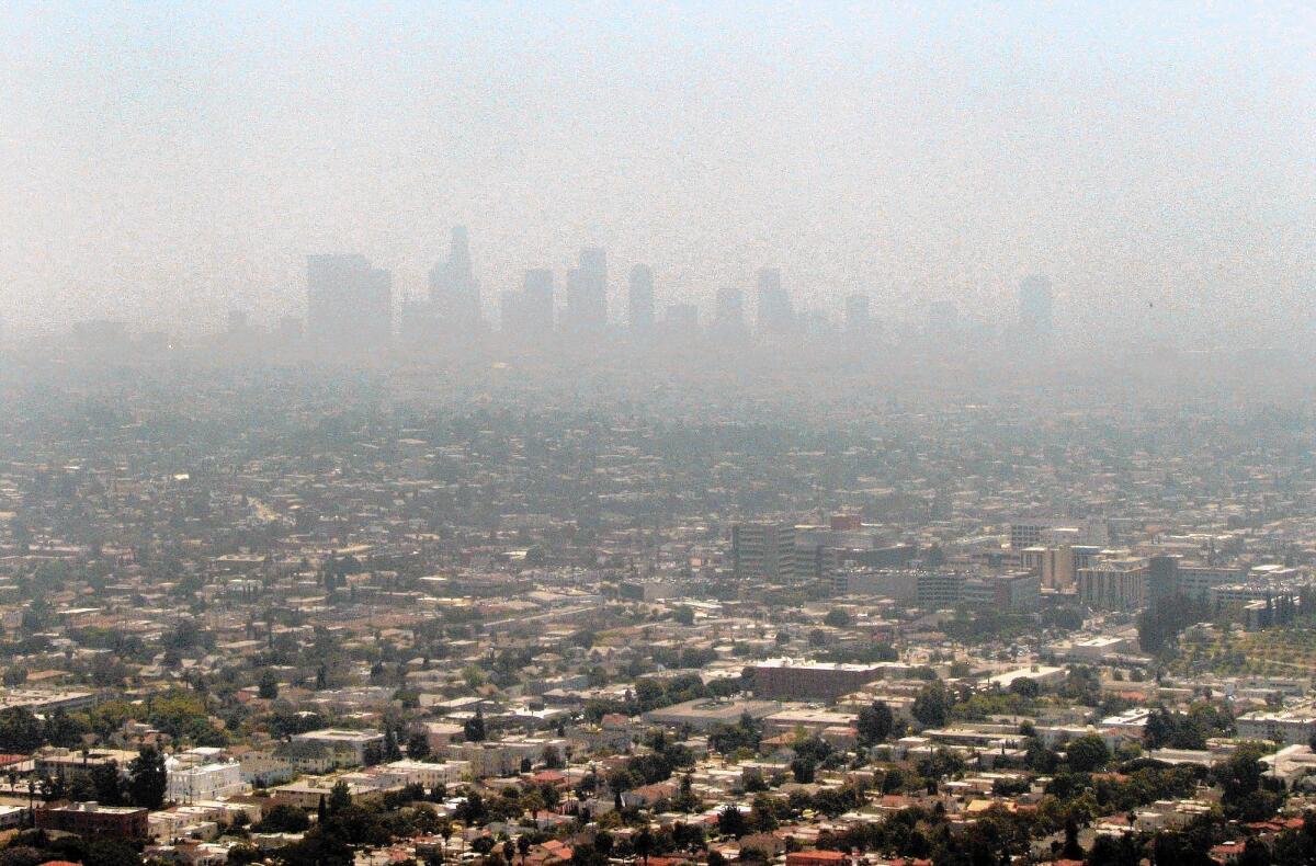 The downtown L.A. skyline is obscured by smog in June 2011. The U.S. EPA staff has recommended a new ozone standard that would mean an even broader swath of the state wouldn't meet air quality rules.