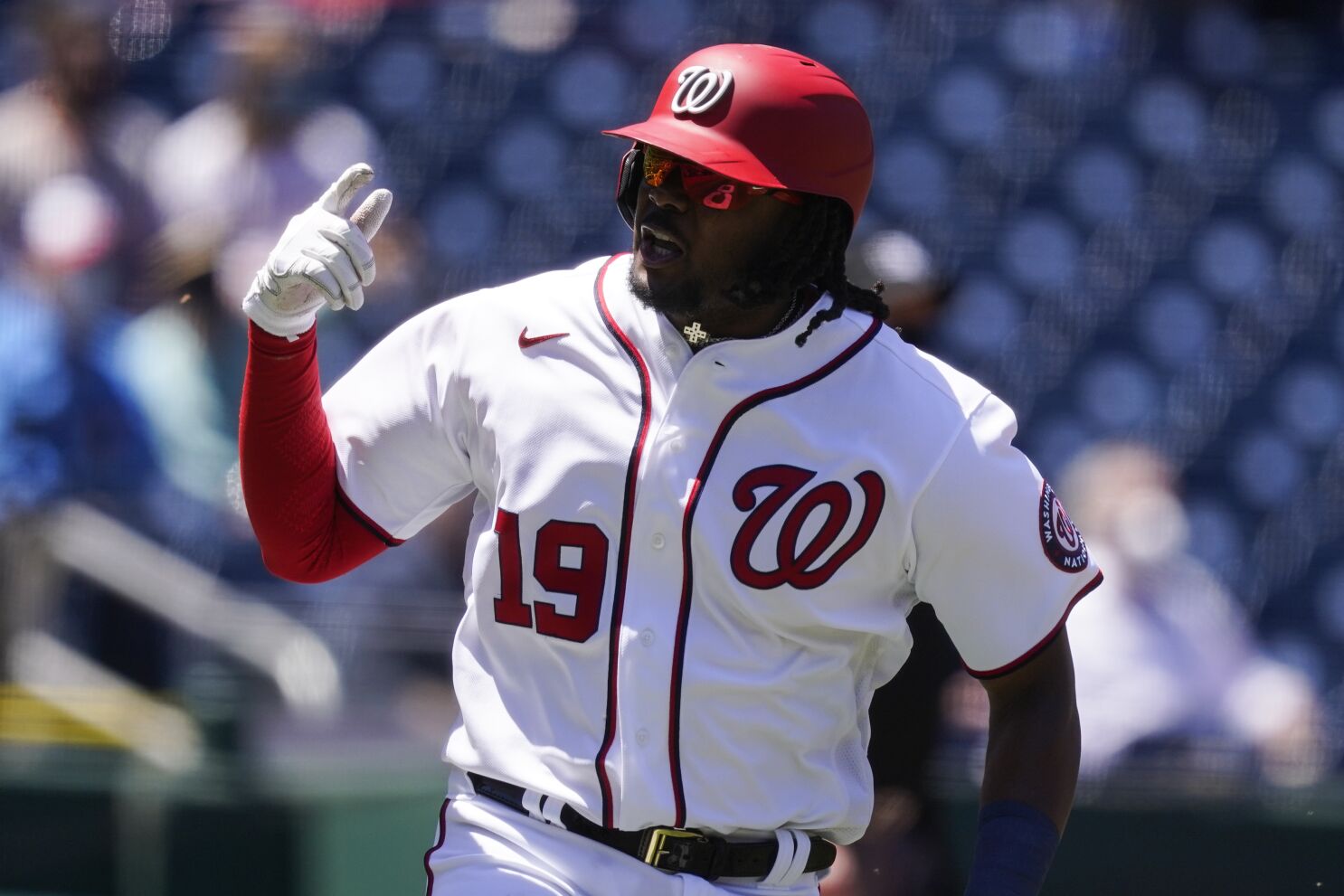 Philadelphia Phillies' Didi Gregorius celebrates and rounds the bases on  his three-run home run as he rounds the bases during the ninth inning of a  baseball game against the Washington Nationals, Wednesday