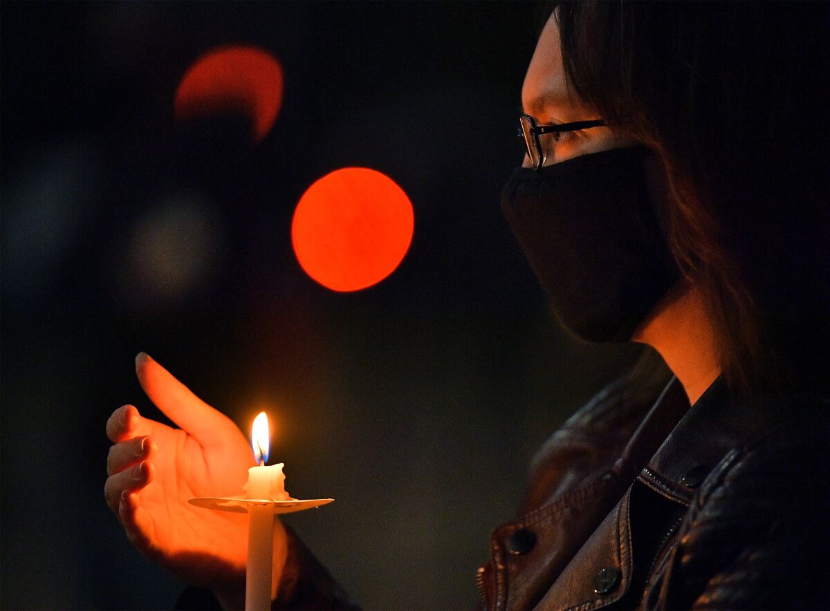 Actor Amy Rauch looks on during a vigil held to honor cinematographer Halyna Hutchins 
