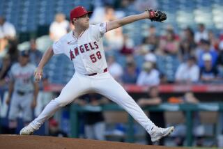 Los Angeles Angels starting pitcher Davis Daniel throws during the first inning.